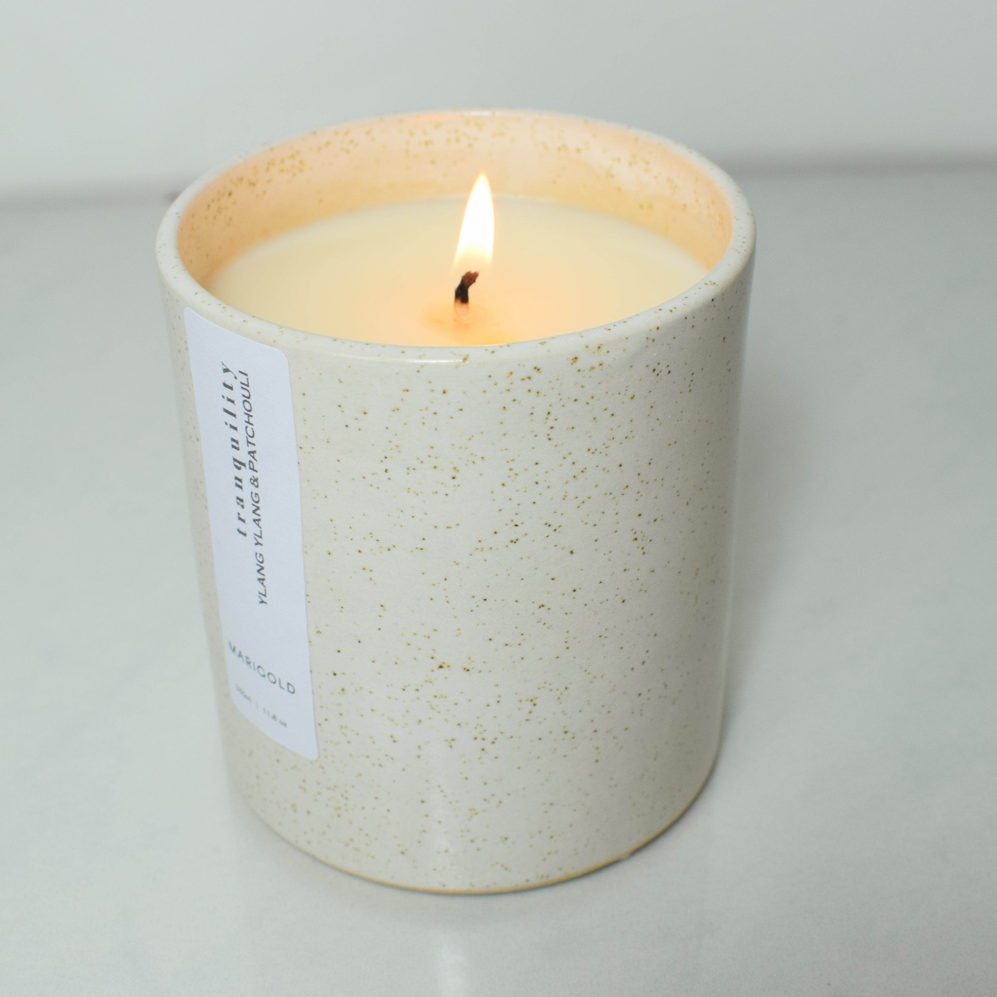 Marigold Charms Tranquility candela ylang ylang e patchouli ricaricabile